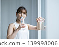 Young woman drinking water 139998006