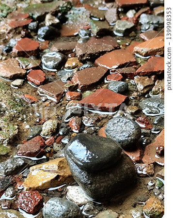 wet and waterlogged rocks after rain 139998353