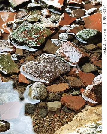 wet and waterlogged rocks after rain wet and waterlogged rocks after rain 139998354