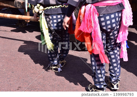 Men participating in the Inuyama Spring Festival in Inuyama City, Aichi Prefecture, are seen wearing traditional happi coats, straw sandals, and brightly colored obi belts. Men participating in the Inuyama Spring Festival in Inuyama City, Aichi Prefecture, are seen wearing traditional happi coats, straw sandals, and brightly colored obi belts. 139998793