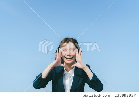 Blue sky and business woman 139998937