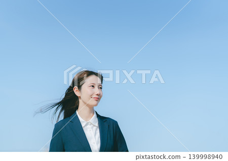 Blue sky and business woman Blue sky and business woman 139998940