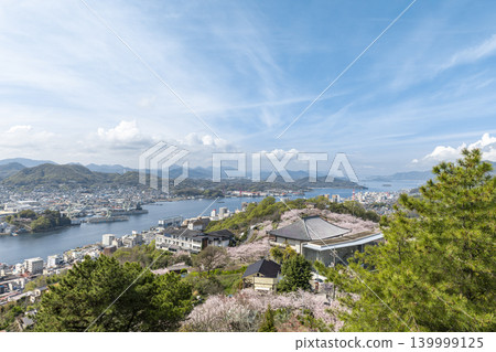 A view of cherry blossoms overlooking the Onomichi Channel and Senkoji Park in spring. A view of cherry blossoms overlooking the Onomichi Channel and Senkoji Park in spring. 139999125