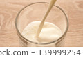 Milk Pouring Into Glass Cup In High Angle View, Lactose Free Dairy Nutrition And Healthy Beverage Concept 139999254