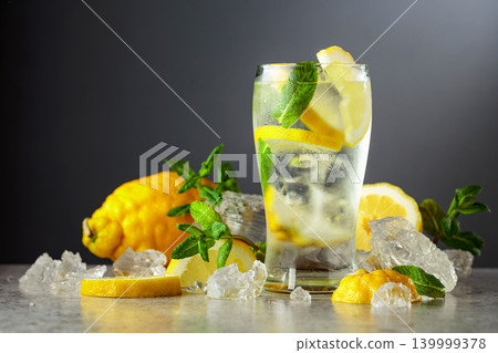 Carbonated refreshing drink with fresh lemon, ice and mint. Carbonated refreshing drink with fresh lemon, ice and mint. 139999378