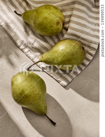 Fresh Green Pears with Sunny Shadows. Top View Fresh Green Pears with Sunny Shadows. Top View 139999533