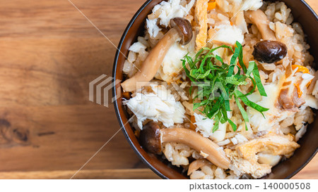 Photo of Japanese-style mixed rice with sea bream, mushrooms, and perilla leaves. 140000508