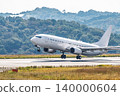 A large white passenger plane taking off. 140000604