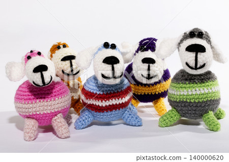 Knitted woolen dogs on a white background Knitted woolen dogs on a white background 140000620