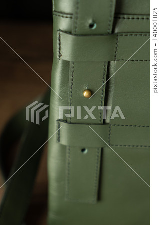 Fashionable mens bag, men purse, wallet men's casual outfits with leather accessories, brown bag on wooden board background Fashionable mens bag, men purse, wallet men's casual outfits with leather accessories, brown bag on wooden board background 140001025