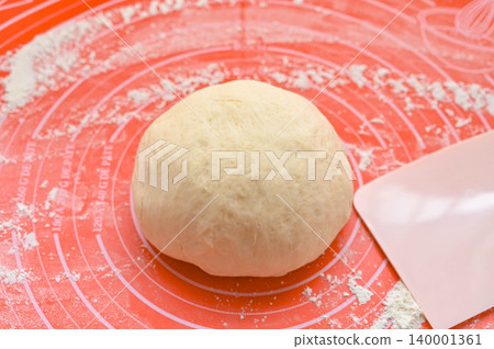 Bread making: White bread dough after the first fermentation. Bread making: White bread dough after the first fermentation. 140001361
