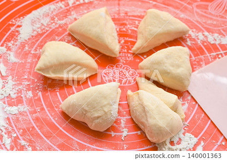 Bread making: Divided white bread dough after first fermentation Bread making: Divided white bread dough after first fermentation 140001363
