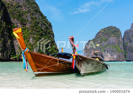 Maya Bay island Phi Phi Leh with longtail boat, turquoise clear water in Krabi Thailand Maya Bay island Phi Phi Leh with longtail boat, turquoise clear water in Krabi Thailand 140001874