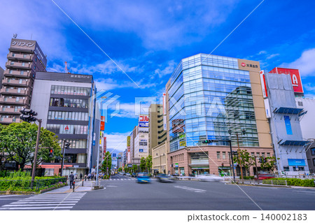 Yokohama cityscape, Japan, May 28th, in front of the north exit of Kannai Station. View of the "Hagoromo-cho" intersection and commuters in the morning. Yokohama cityscape, Japan, May 28th, in front of the north exit of Kannai Station. View of the "Hagoromo-cho" intersection and commuters in the morning. 140002183