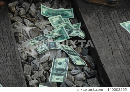 American Dollars on a Train Track American Dollars on a Train Track 140002265