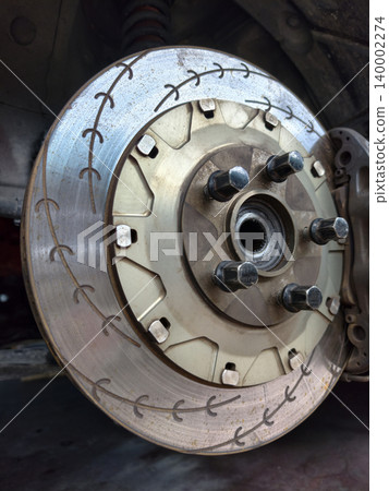 High performance slotted car brake rotor close up view High performance slotted car brake rotor close up view 140002274