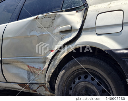 Car door damaged and dented after traffic accident crash Car door damaged and dented after traffic accident crash 140002280