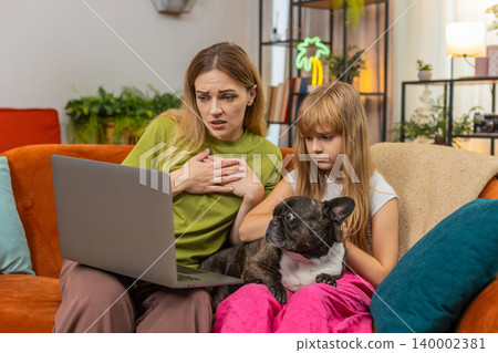 Mother daughter dog lose contest or game on laptop sigh feel sad support each other hug family care Mother daughter dog lose contest or game on laptop sigh feel sad support each other hug family care 140002381