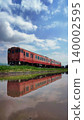 A reflection of a Kiha 40 series train in water. A reflection of a Kiha 40 series train in water. 140002595