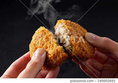 Crispy beef croquettes placed on a black background. Crispy beef croquettes placed on a black background. 140002693
