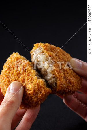 Crispy beef croquettes placed on a black background. Crispy beef croquettes placed on a black background. 140002695