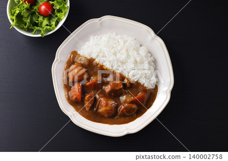 Curry rice with plenty of chunky vegetables Curry rice with plenty of chunky vegetables 140002758