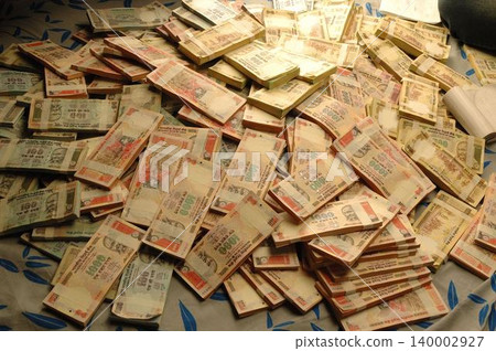 Indian Currency on Bed Indian Currency on Bed 140002927