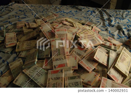 Indian Currency on Bed Indian Currency on Bed 140002931