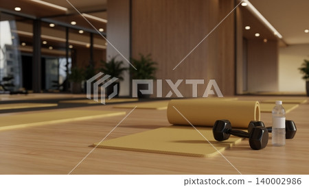 Water bottle and black dumbbell on yellow yoga mat across mirror in modern fitness gym exercise room Water bottle and black dumbbell on yellow yoga mat across mirror in modern fitness gym exercise room 140002986