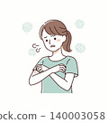 A woman with crossed arms expressing discomfort, possibly due to skin irritation, allergy, or rash on her arm. She appears concerned and uneasy. 140003058