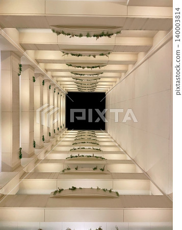 Looking up at the sky from the courtyard 140003814