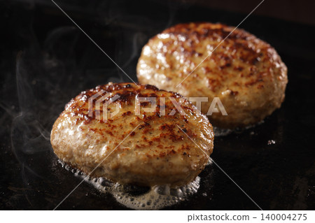 Steaming juicy hamburger steak Steaming juicy hamburger steak 140004275