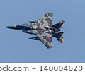 A circling F-15DJ (aggressor) 140004620