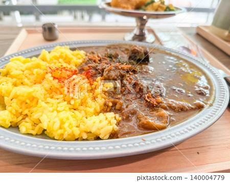 A plate of beef curry and turmeric rice. A plate of beef curry and turmeric rice. 140004779