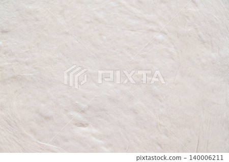 A whole sheet of stretched bread dough 140006211