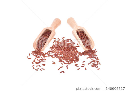 red rice in wooden scoop isolated on white background red rice in wooden scoop isolated on white background 140006317