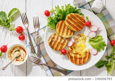 grilled cheese rounds on a plate with radishes grilled cheese rounds on a plate with radishes 140006765