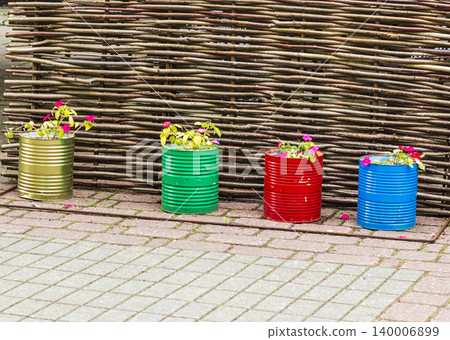 The image features a creative garden decoration using upcycled materials The image features a creative garden decoration using upcycled materials 140006899