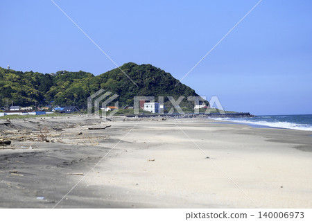 White sandy beaches and the sea; a tranquil landscape of a cape overgrown with fresh greenery. White sandy beaches and the sea; a tranquil landscape of a cape overgrown with fresh greenery. 140006973