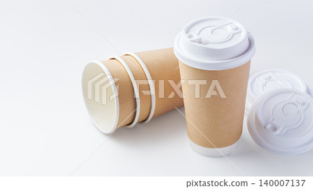 Takeaway paper cups with lids mockup on white background Takeaway paper cups with lids mockup on white background 140007137