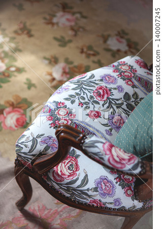 Antique furniture and decorative rug in a living room Antique furniture and decorative rug in a living room 140007245