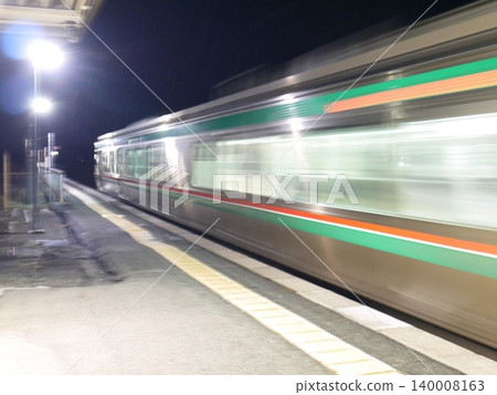 A local train station platform at night 140008163