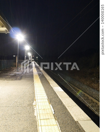 A local train station platform at night A local train station platform at night 140008165