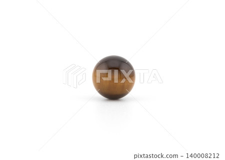 Round tiger eye stone on a plain background 140008212