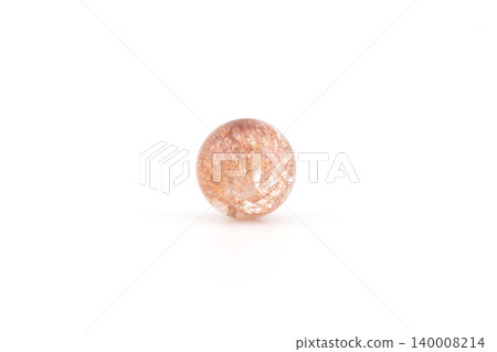 Tangerine quartz sphere on white background with natural patterns Tangerine quartz sphere on white background with natural patterns 140008214