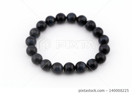 Blue tiger eye natural stone bracelet on a white background 140008225