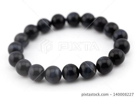 Blue tiger eye natural stone bracelet on a white background 140008227