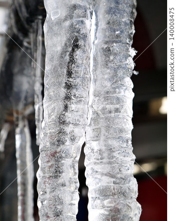 Icicles hanging from the roof Icicles hanging from the roof 140008475