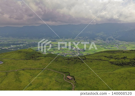 An aerial photograph overlooking the grasslands and caldera basin of Minami Aso, Kumamoto Prefecture. An aerial photograph overlooking the grasslands and caldera basin of Minami Aso, Kumamoto Prefecture. 140008520