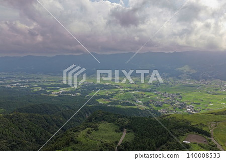 An aerial photograph overlooking rice paddies and rural settlements in Minami-Aso, Kumamoto Prefecture. An aerial photograph overlooking rice paddies and rural settlements in Minami-Aso, Kumamoto Prefecture. 140008533